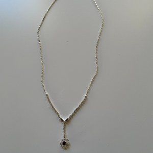 Silver necklace with purple gemstone